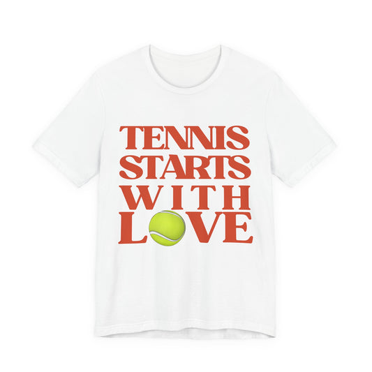White t-shirt with 'Tennis Starts With Love' text and tennis ball graphic on a white background
