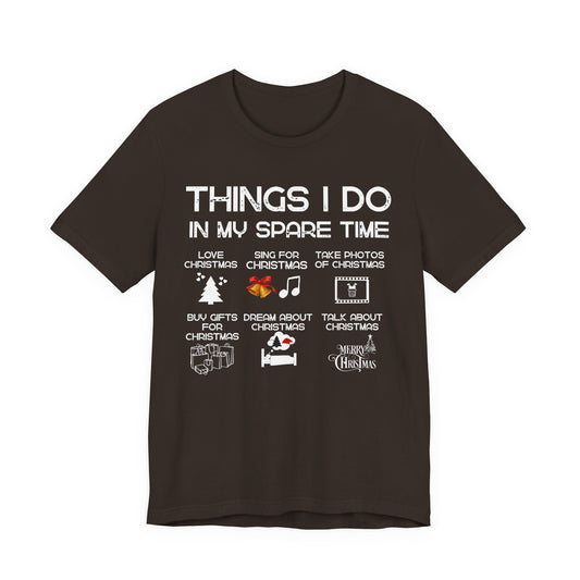 Black t-shirt with white text and Christmas-themed graphics on a white background