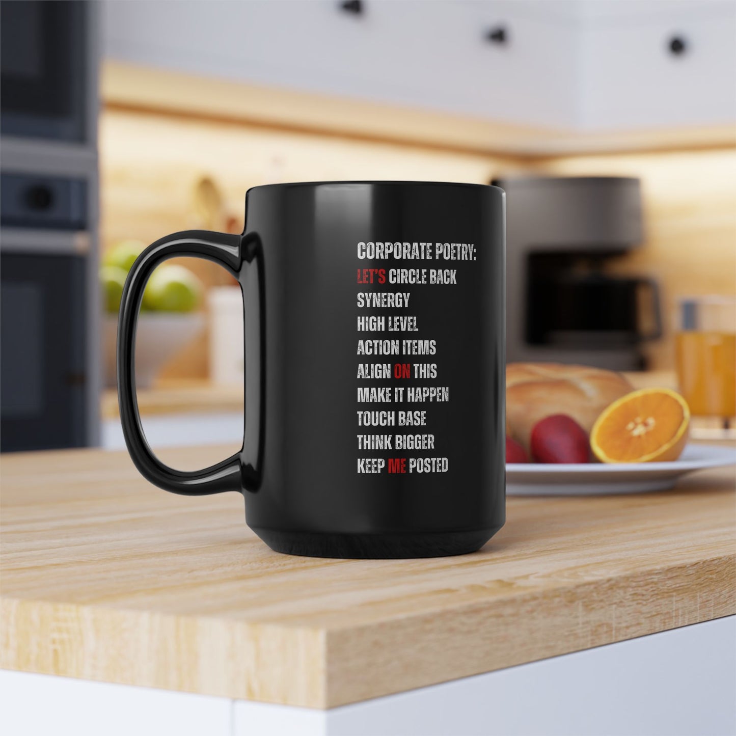Black mug with text on a kitchen counter I love my job as boss mug
