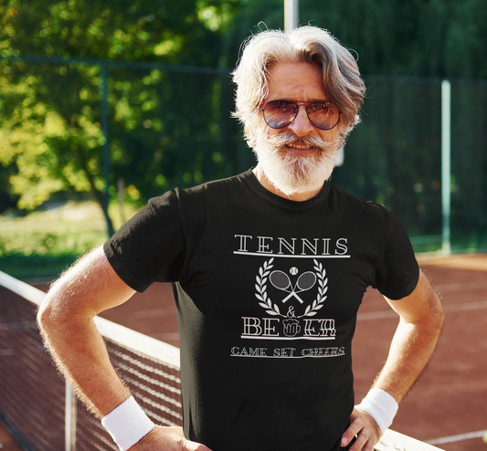 Man wearing a black t-shirt with tennis and beer design on a tennis court