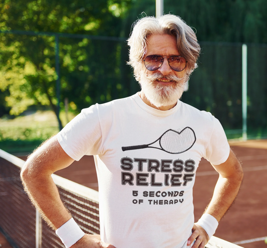 Man wearing a t-shirt with a tennis racket and text on a tennis court
