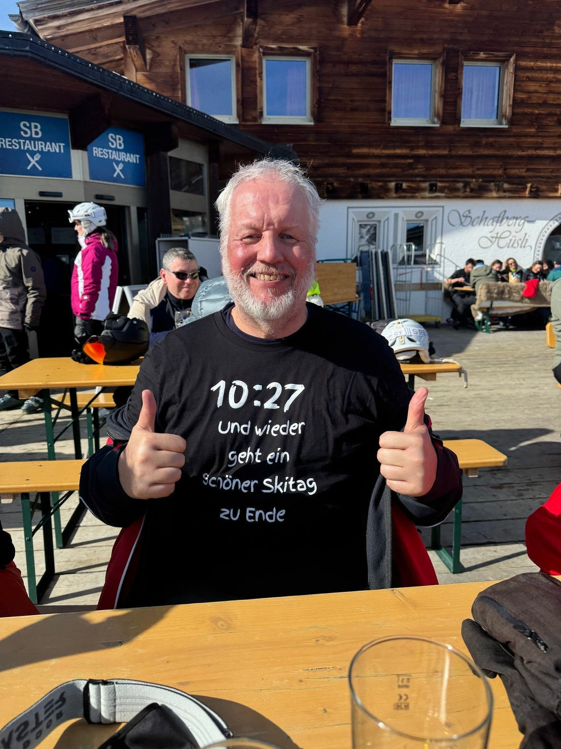 Laluedesign.com founder wearing the best-selling Ski T-shirt outdoors in ski resort putting the thumbs up. 