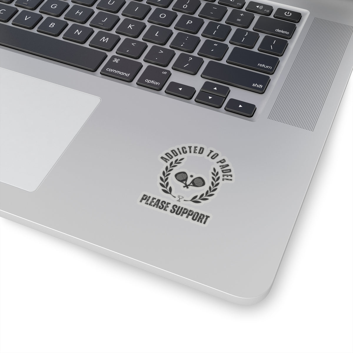 Laptop with a sticker on the palm rest area