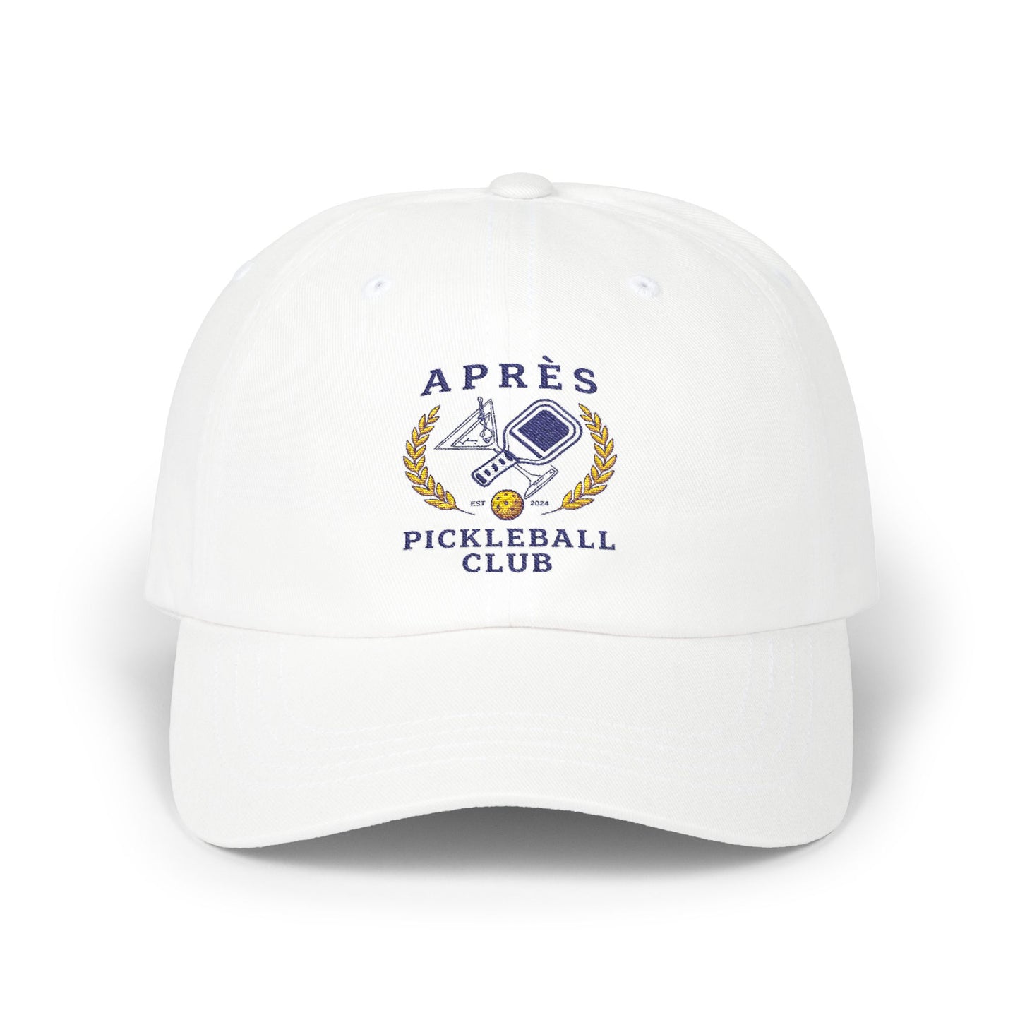 White cap with 'Apres Pickleball Club' logo on a white background