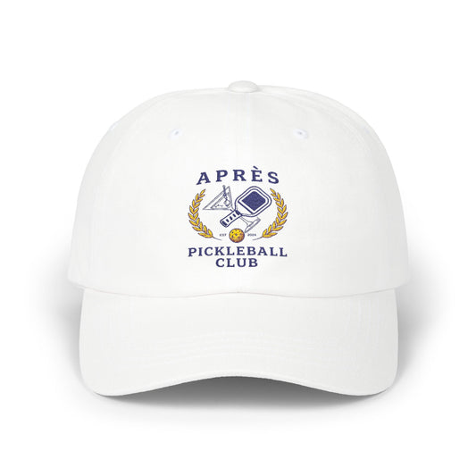 White cap with 'Apres Pickleball Club' logo on a white background