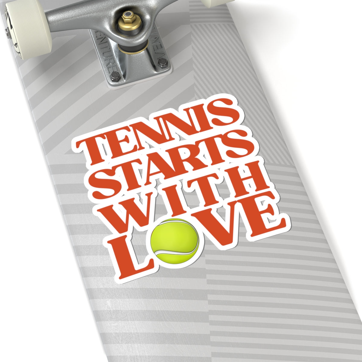 Skateboard with 'Tennis Starts with Love' sticker and tennis ball graphic