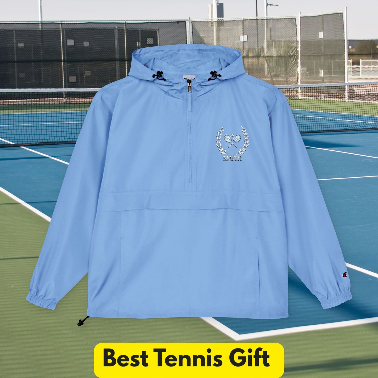 Tennis jacket Blue hooded jacket with a logo on a tennis court, labeled 'Best Tennis Gift'.