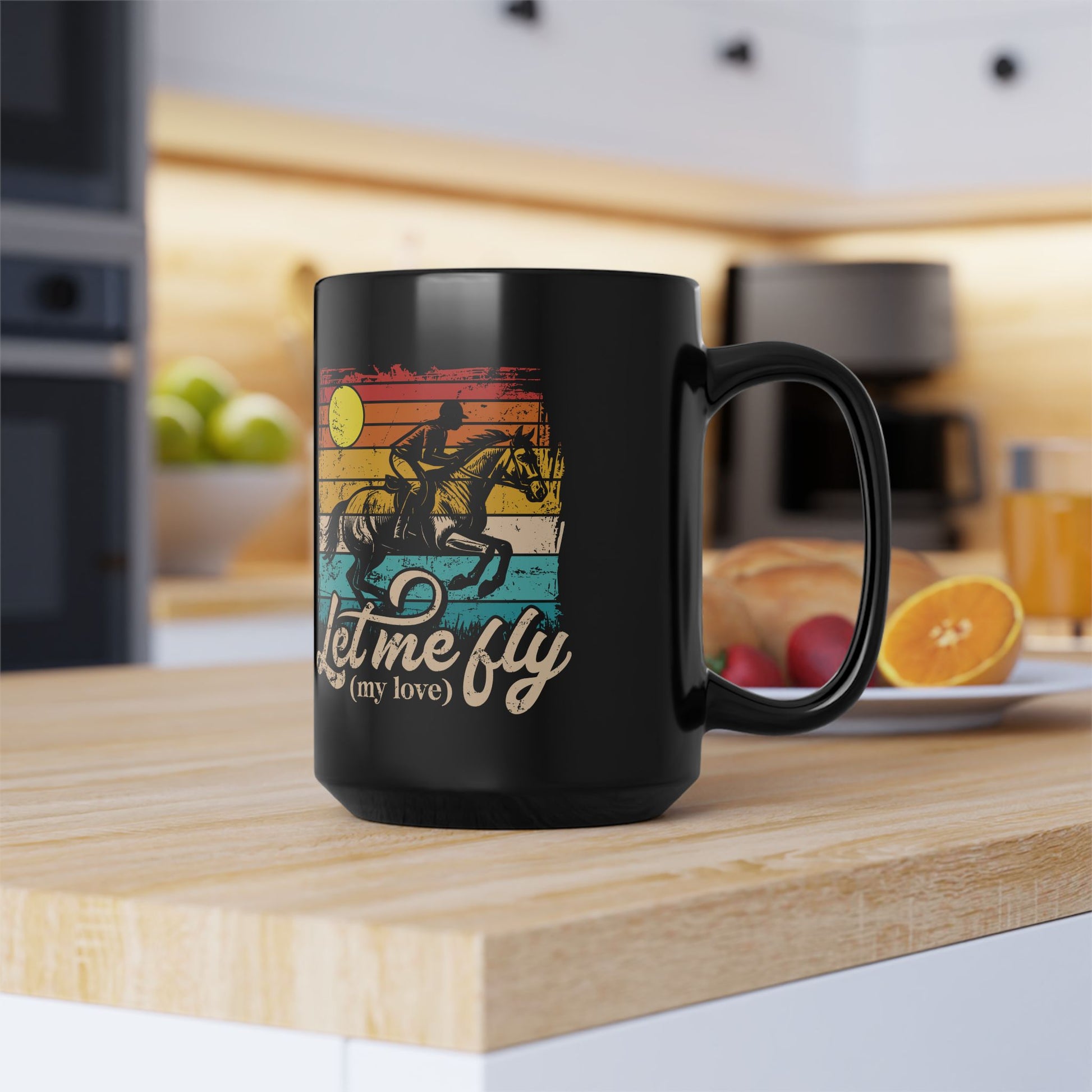 Black mug with a colorful graphic and text on a kitchen counter