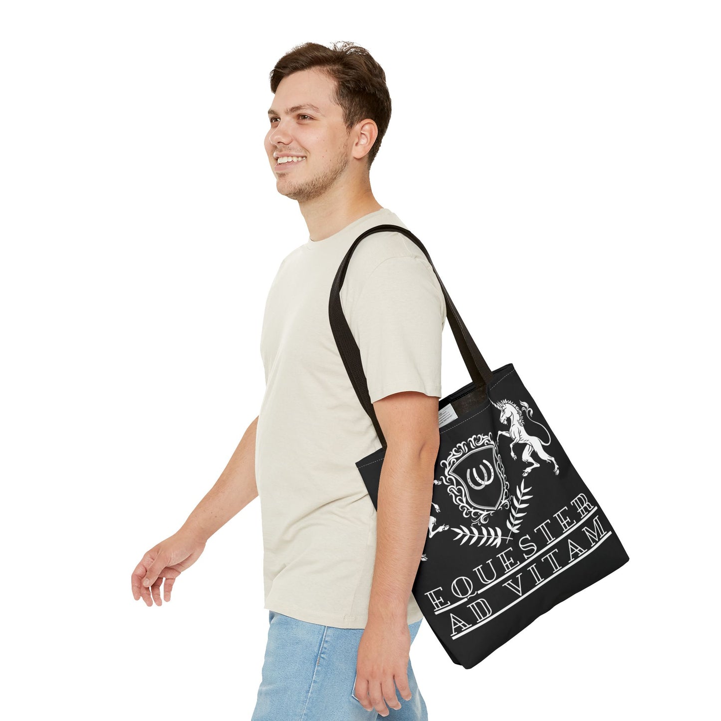 Man carrying a black tote bag with white text and design on a white background