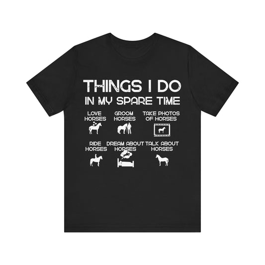 Black t-shirt with white text and horse-related graphics on a white background