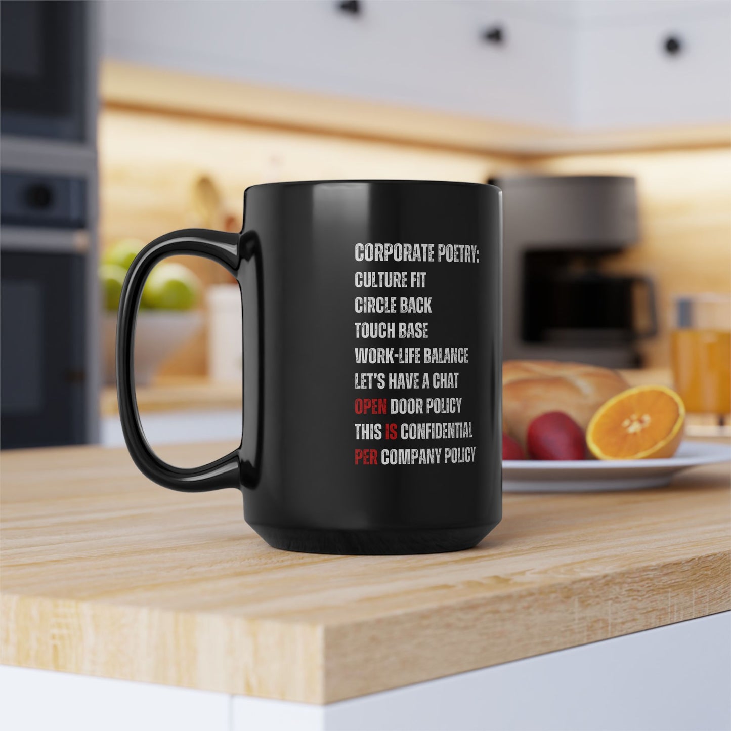 Black mug with text on a kitchen counter