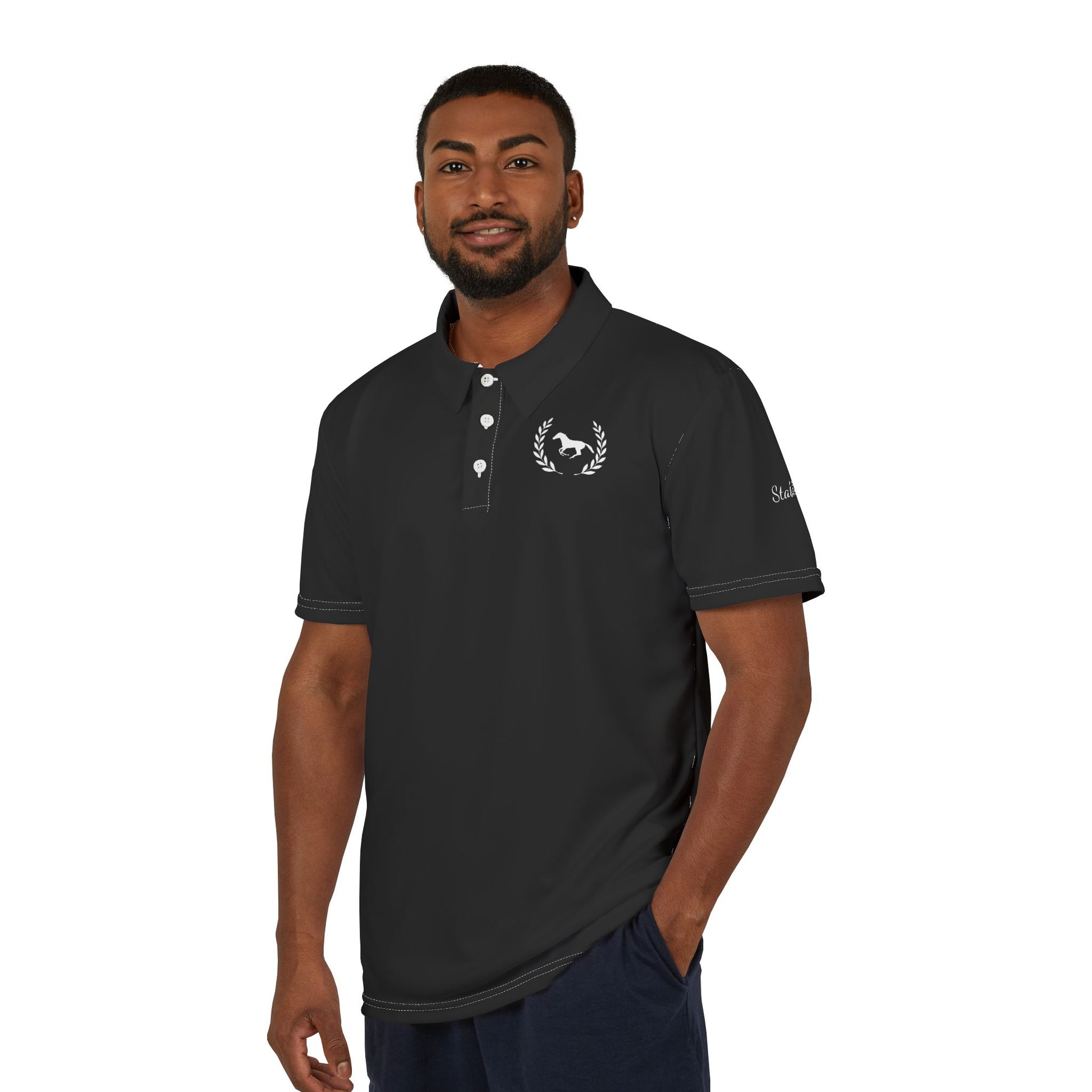 Man wearing a black polo shirt with a logo on a white background
