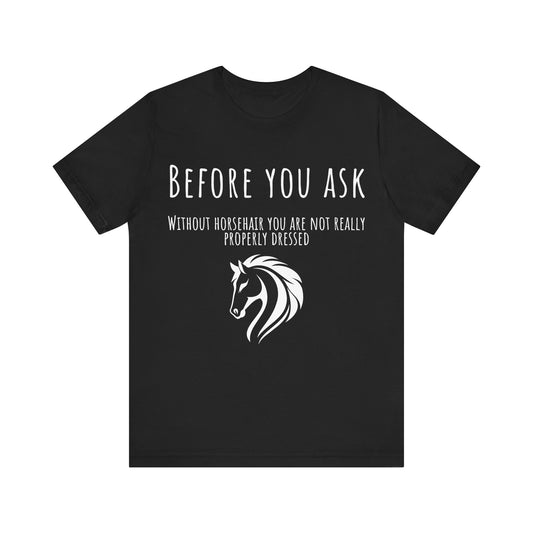 Black t-shirt with white text and horse graphic on a white background