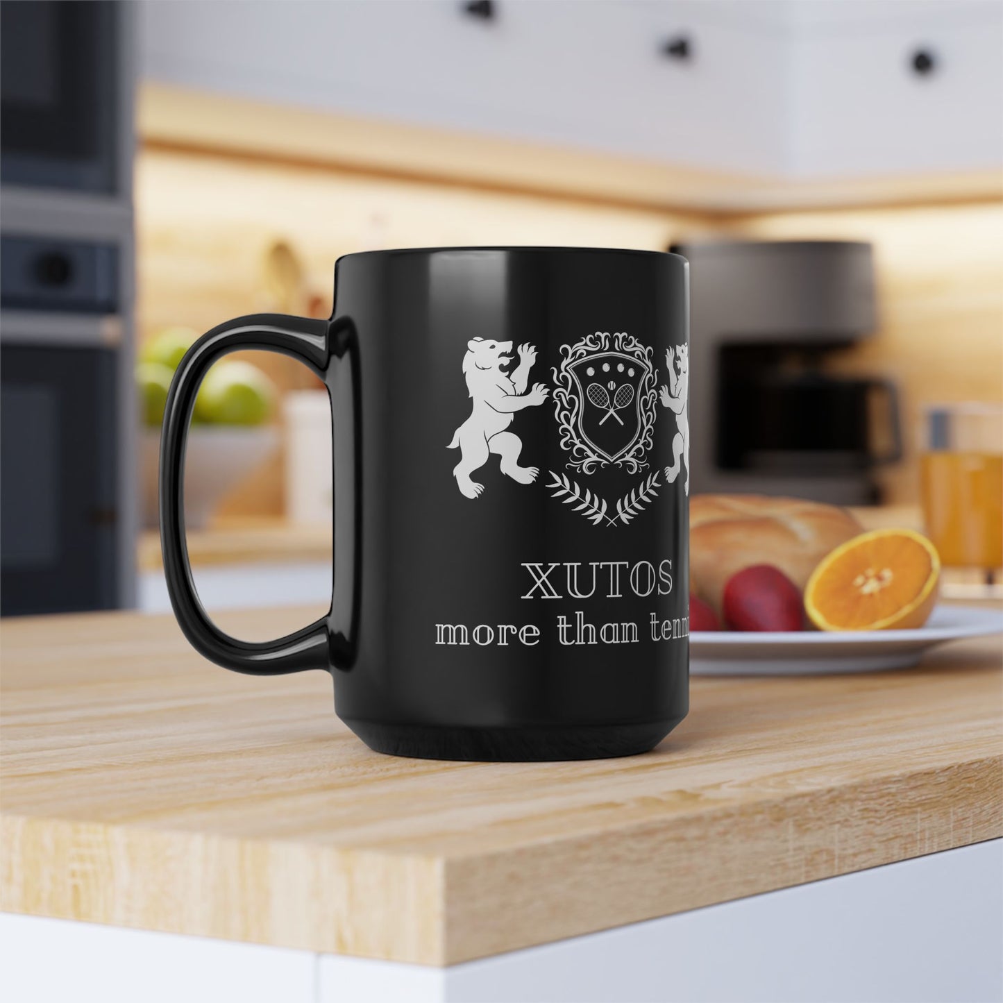 Black XUTOS mug with white design and text on a kitchen counter
