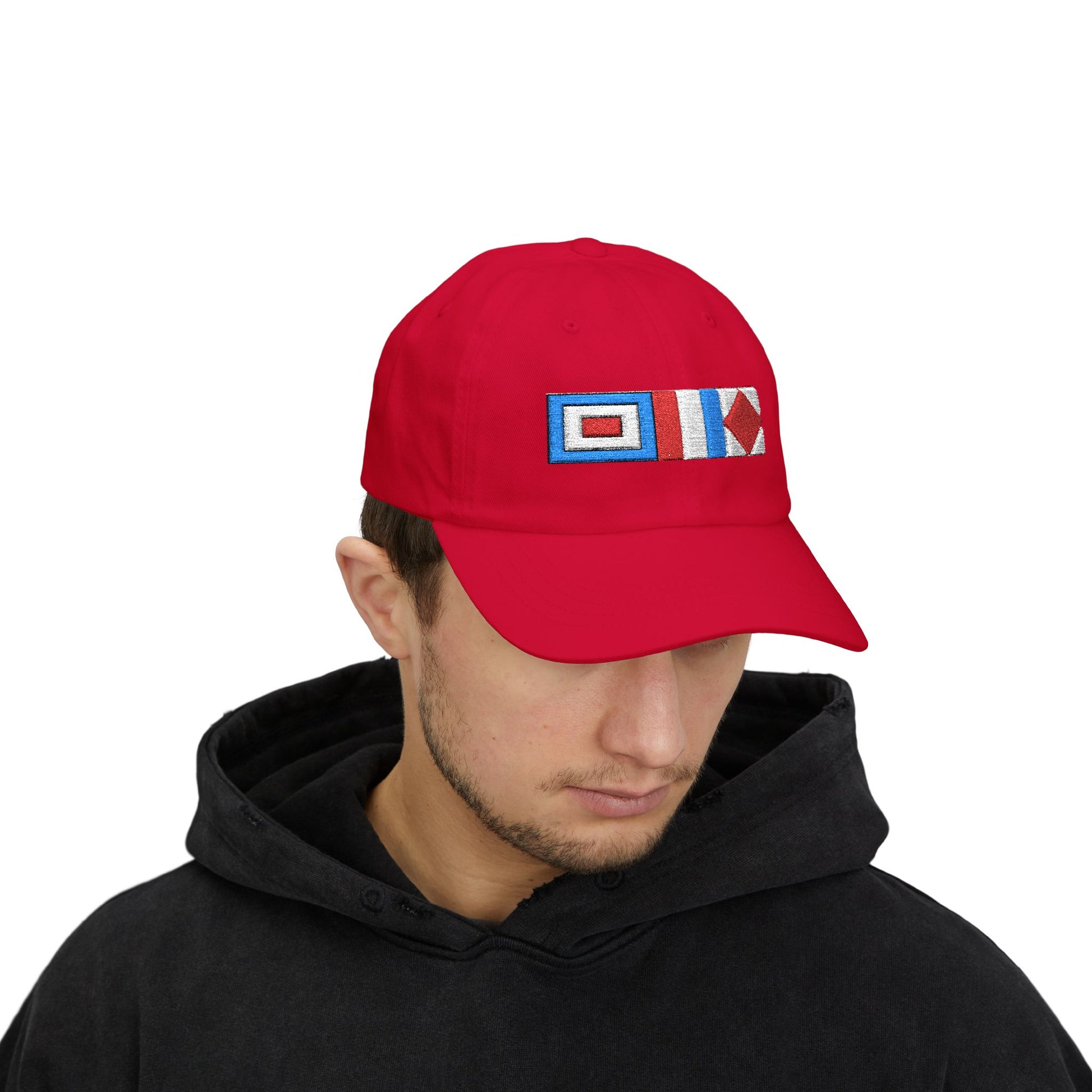 Sailor Cap Person wearing a red cap with a blue astrological symbol on a white background