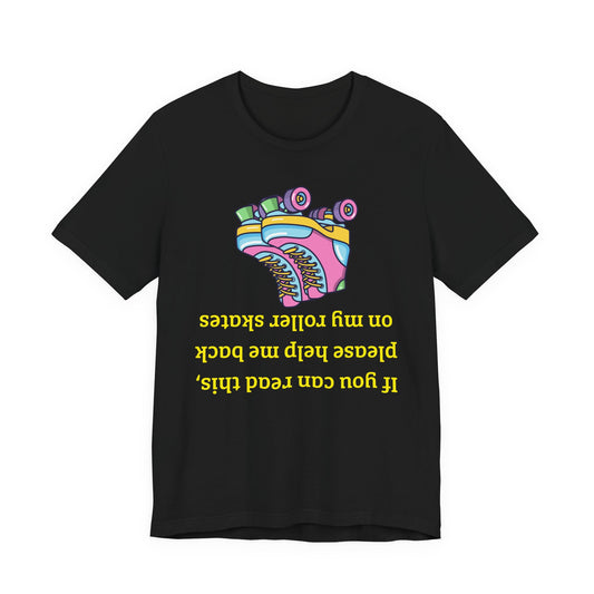 Roller skate shirt A black short-sleeve crewneck t-shirt featuring a colorful graphic of roller skates and yellow text that reads 'If you can read this, please help me back on my roller skates' in upside-down lettering.