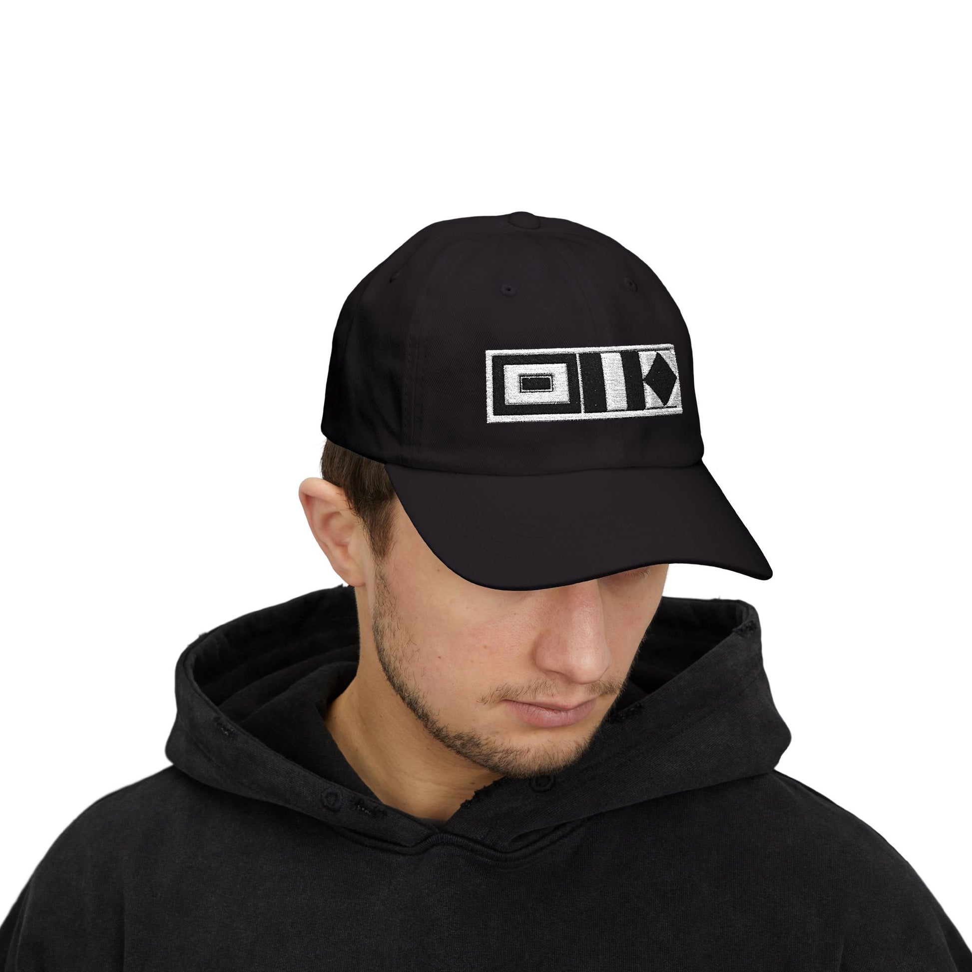 Sailing Cap Person wearing a black cap with white text on a white background