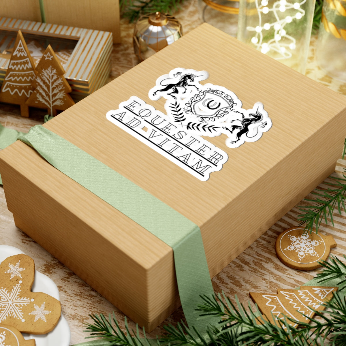 Wooden gift box with a decorative sticker on a festive background with cookies and greenery.