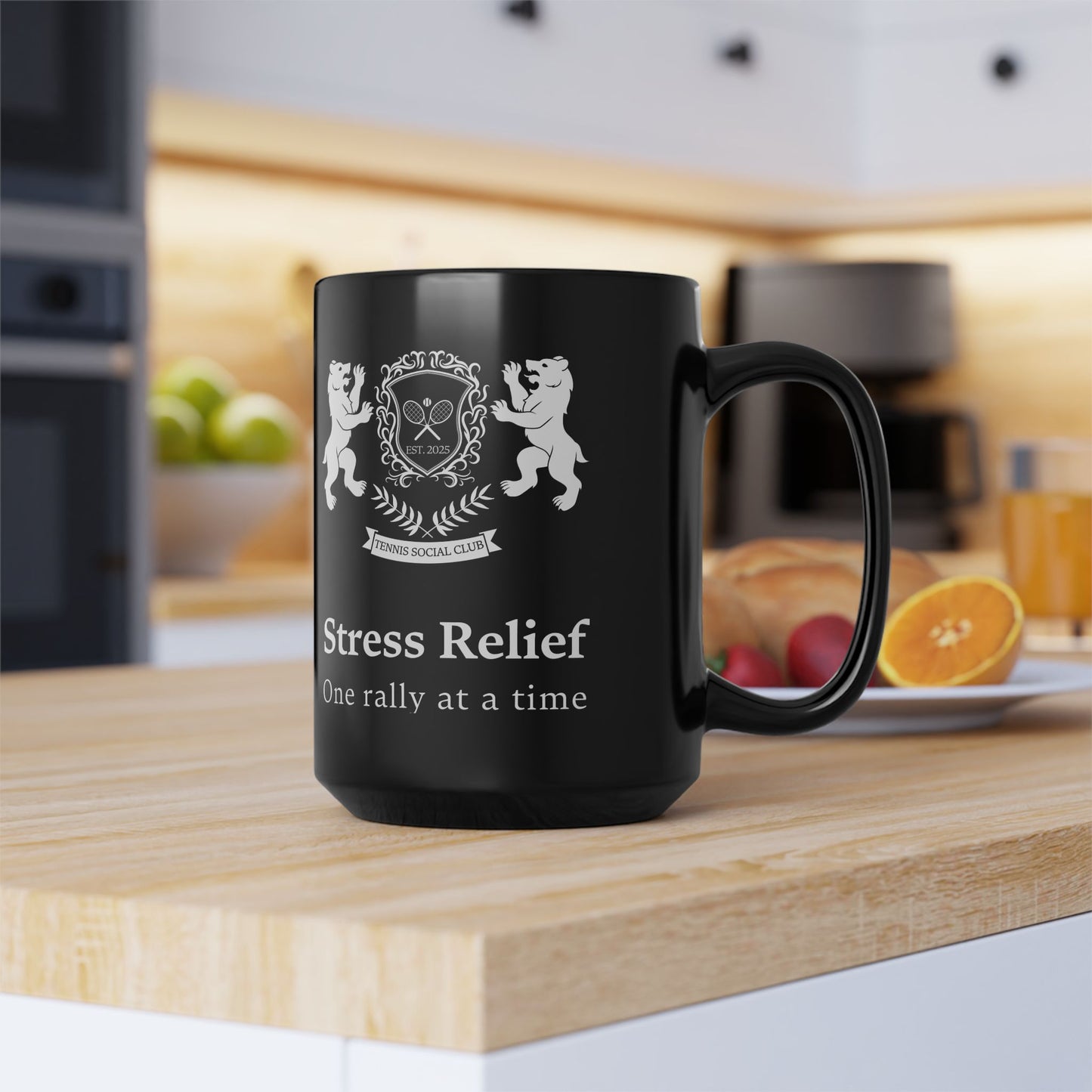 Tennis Mug Black mug with 'Stress Relief' text and emblem on a kitchen counter.
