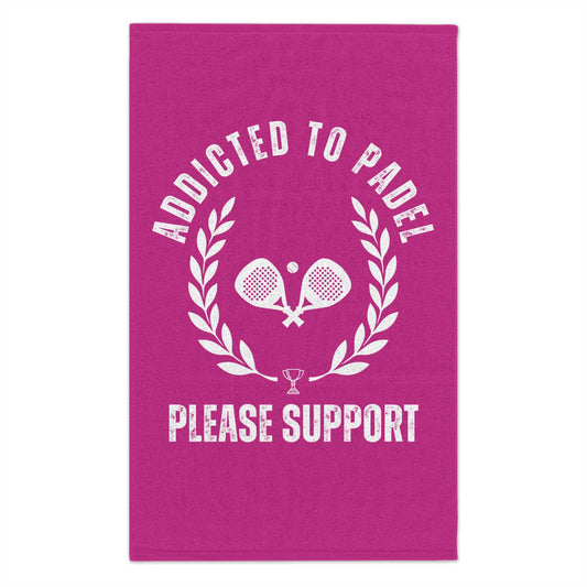 Pink towel with 'Addicted to Padel Please Support' text and paddle graphics on a white background