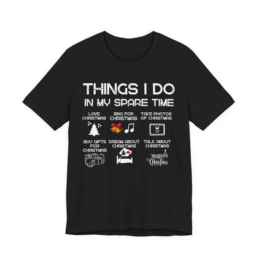 Black t-shirt with white text and Christmas-themed graphics on a white background