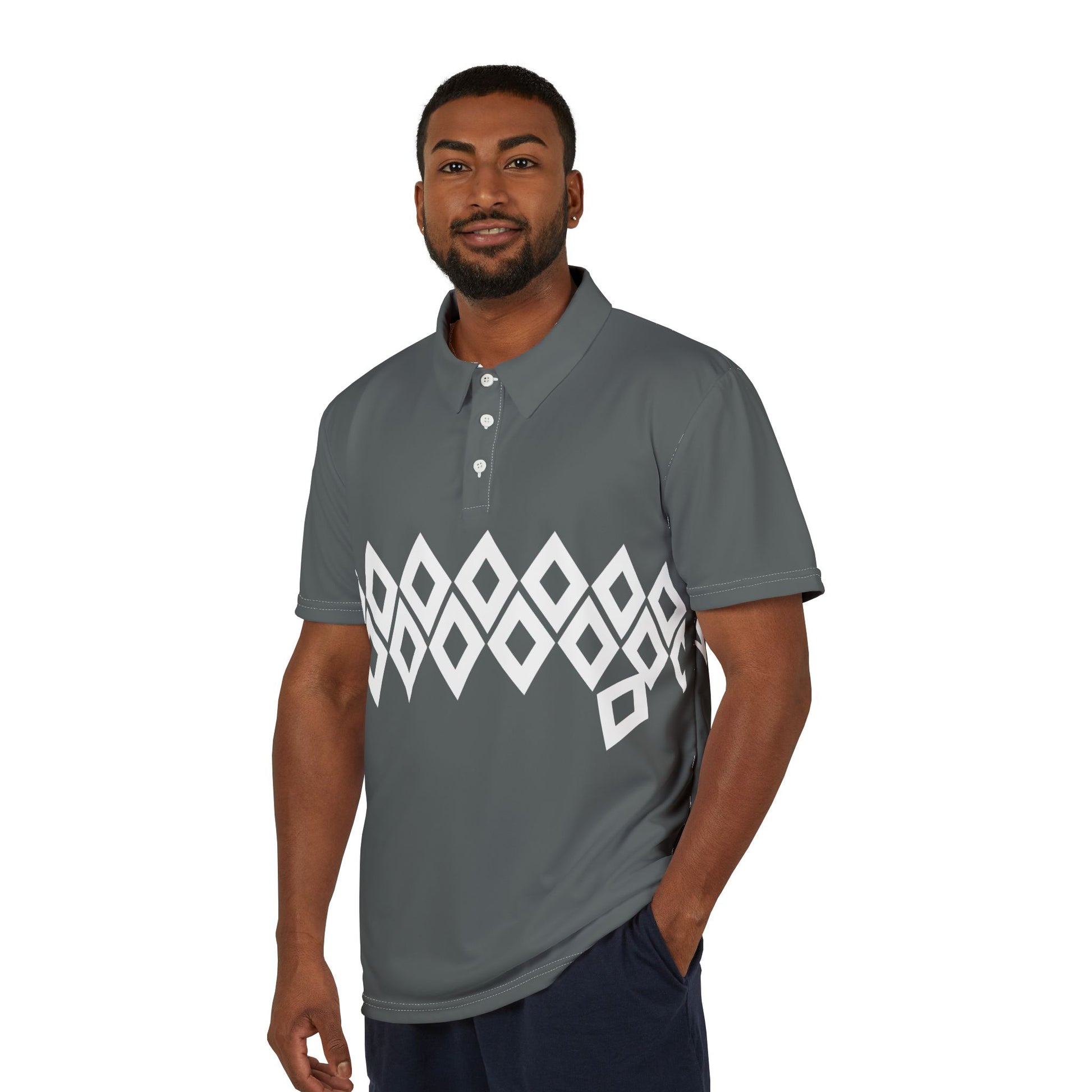 Man wearing a gray polo shirt with a white geometric pattern on a white background