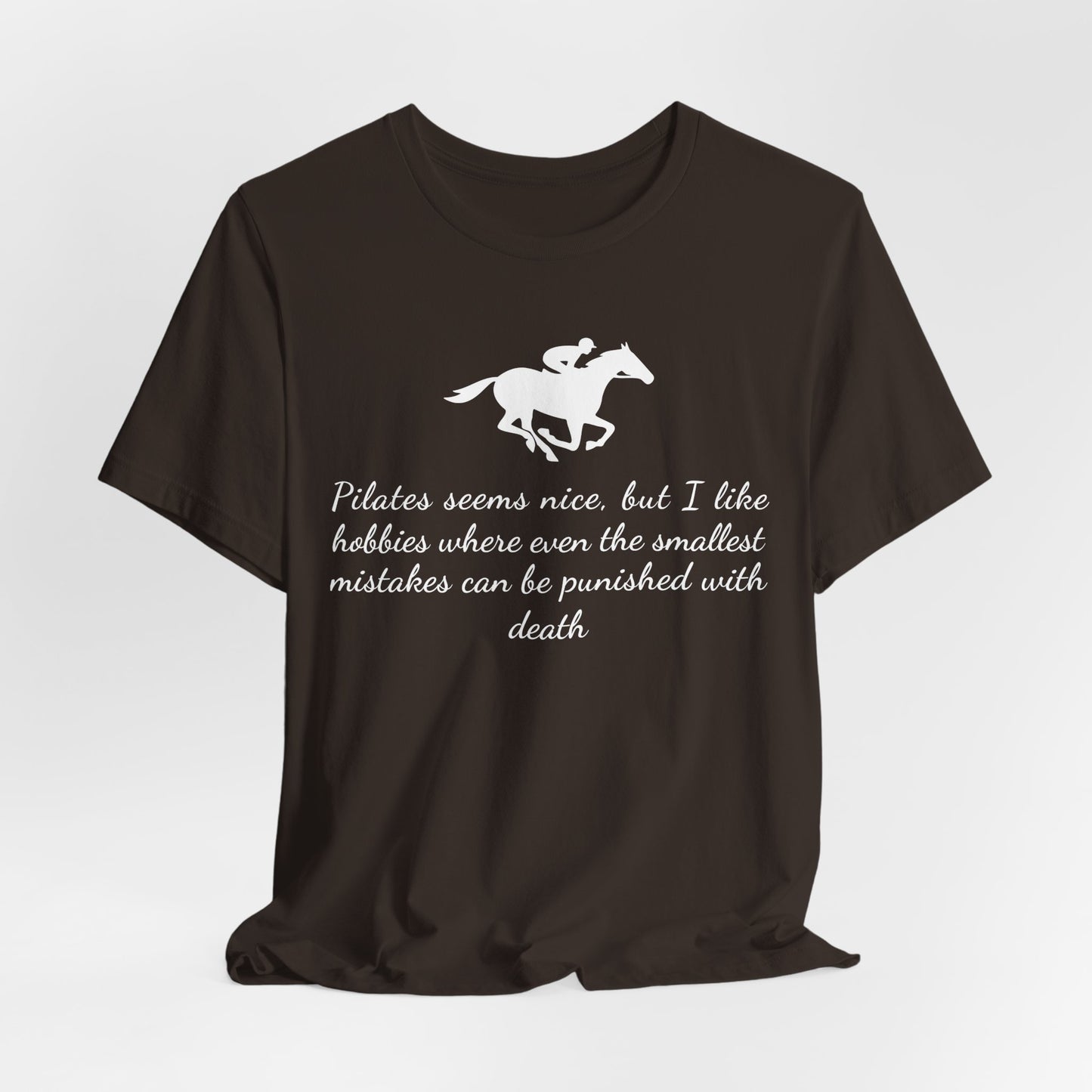 Black t-shirt with white horse graphic and text on a light gray background