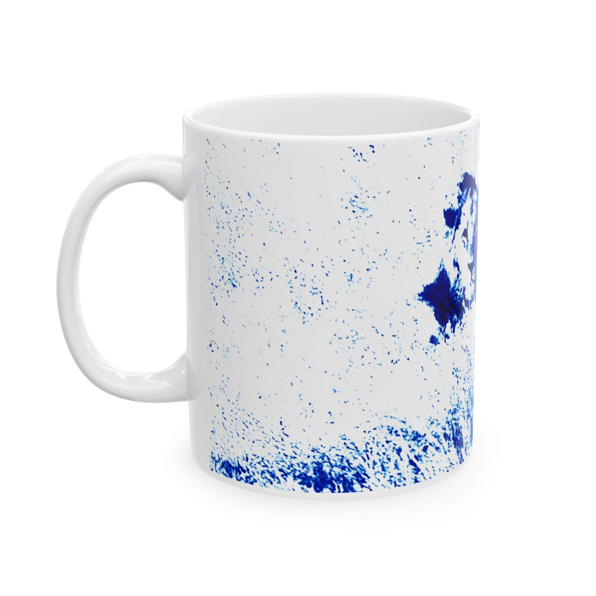 White mug with blue speckled pattern on a white background