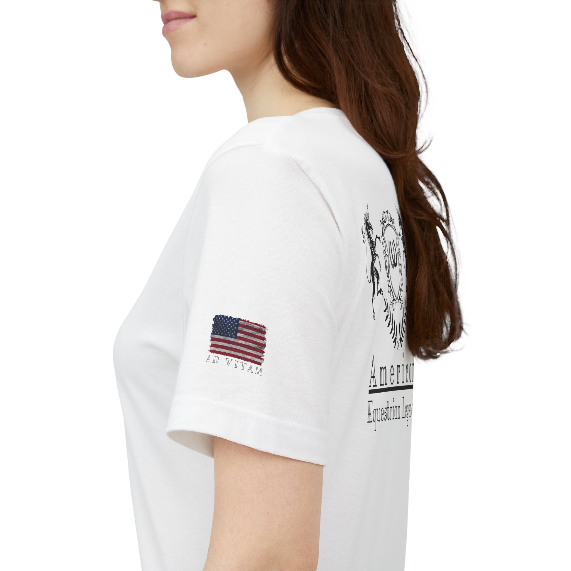 White t-shirt with American flag design on sleeve and text on back, worn by a person.