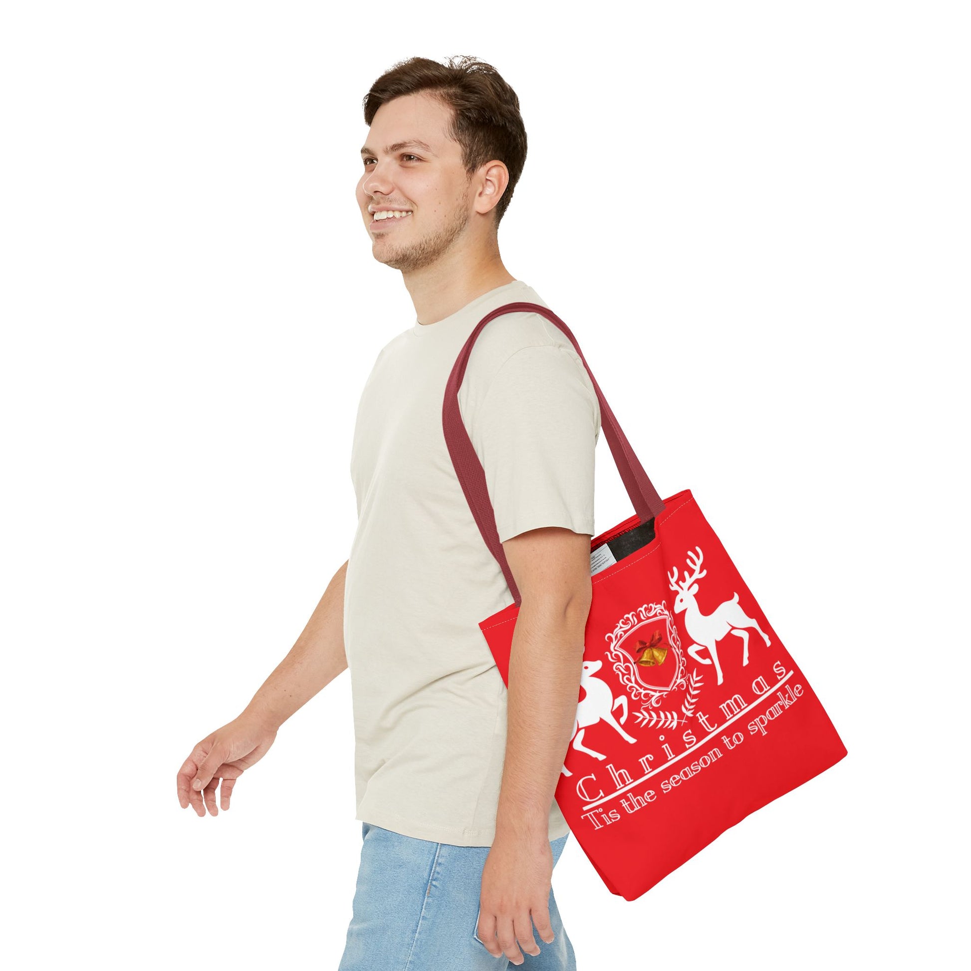 Man carrying a red tote bag with Christmas design on a white background