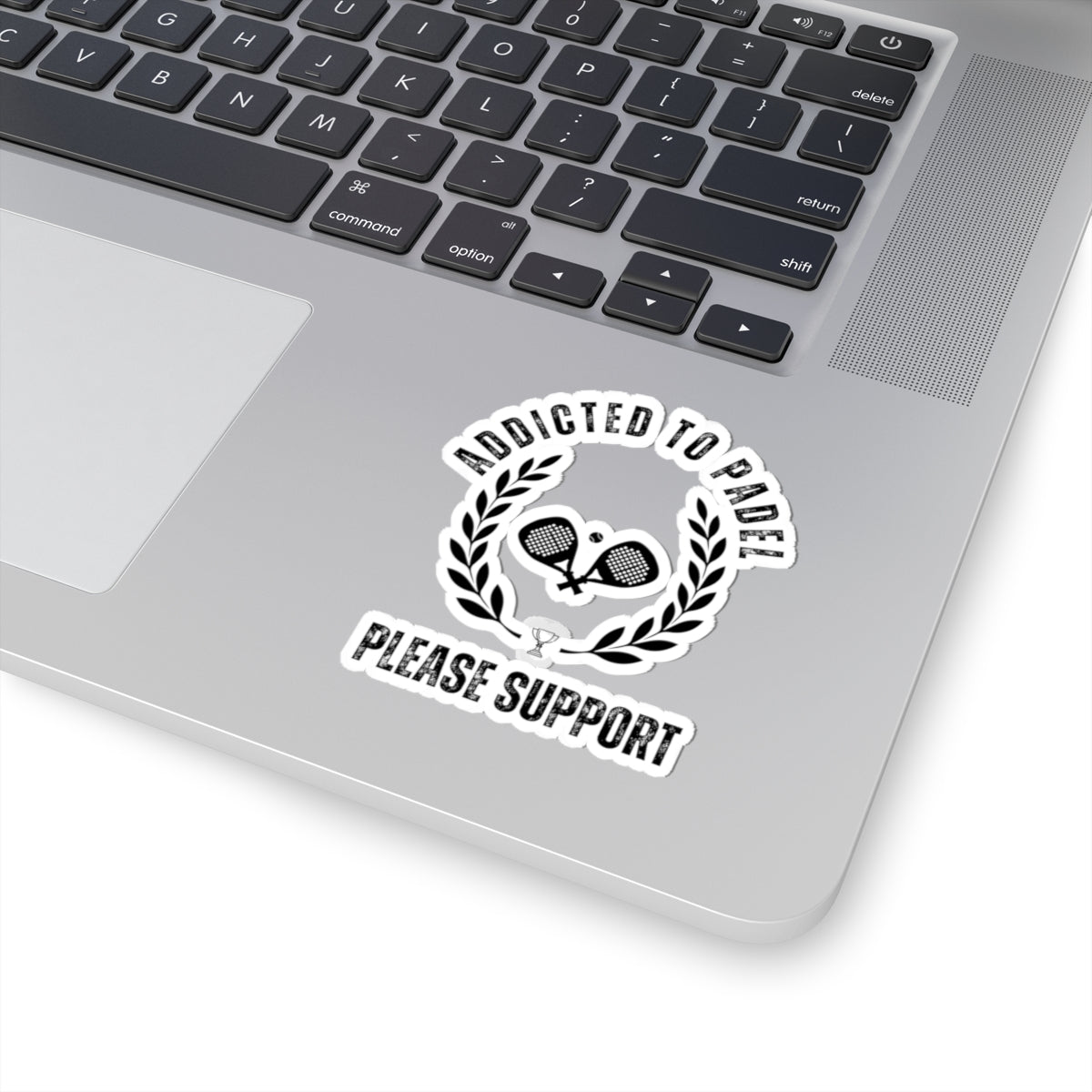 Laptop with a sticker that reads 'Addicted to Paddle Please Support' on the palm rest area.