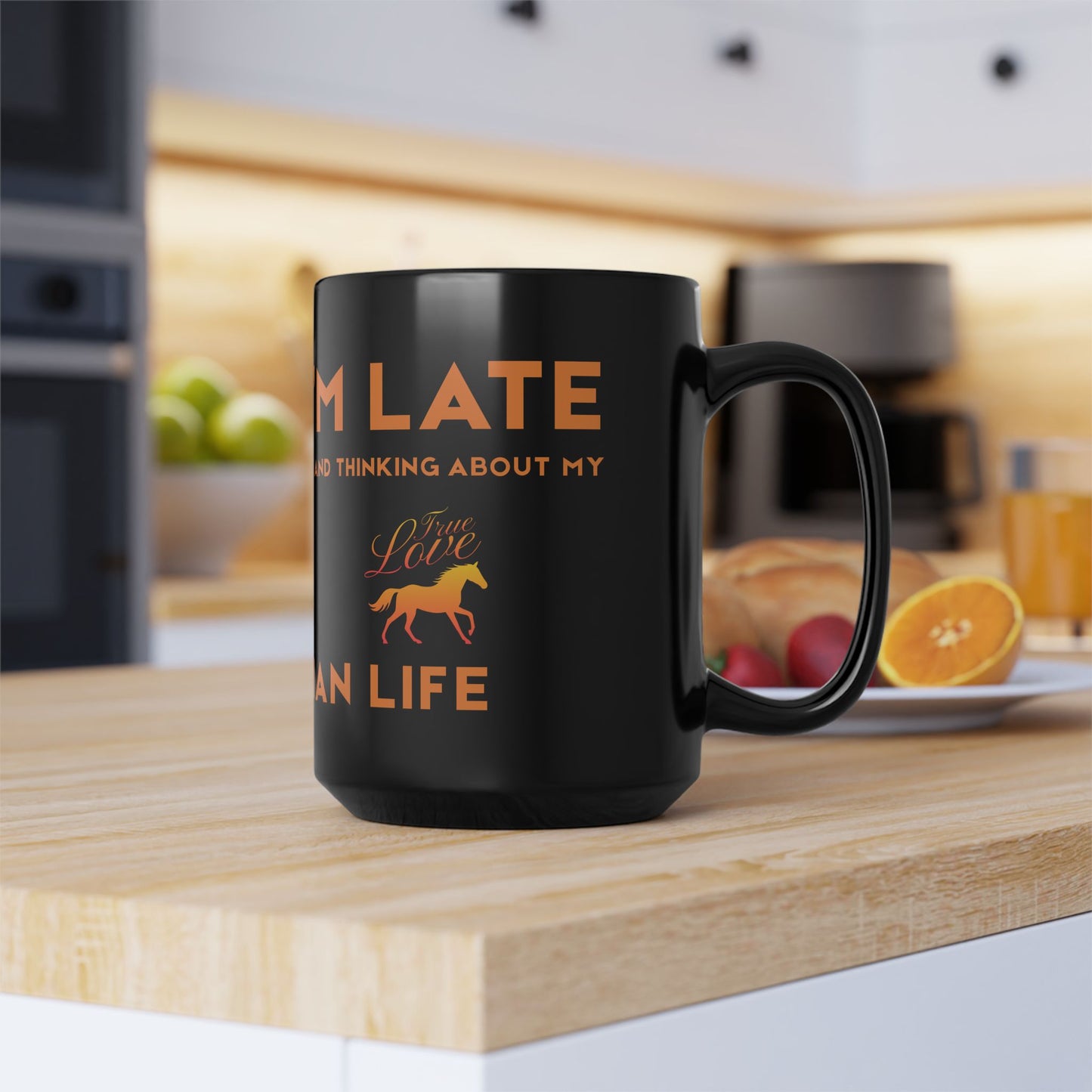 Black mug with orange text and a horse graphic on a kitchen counter.
