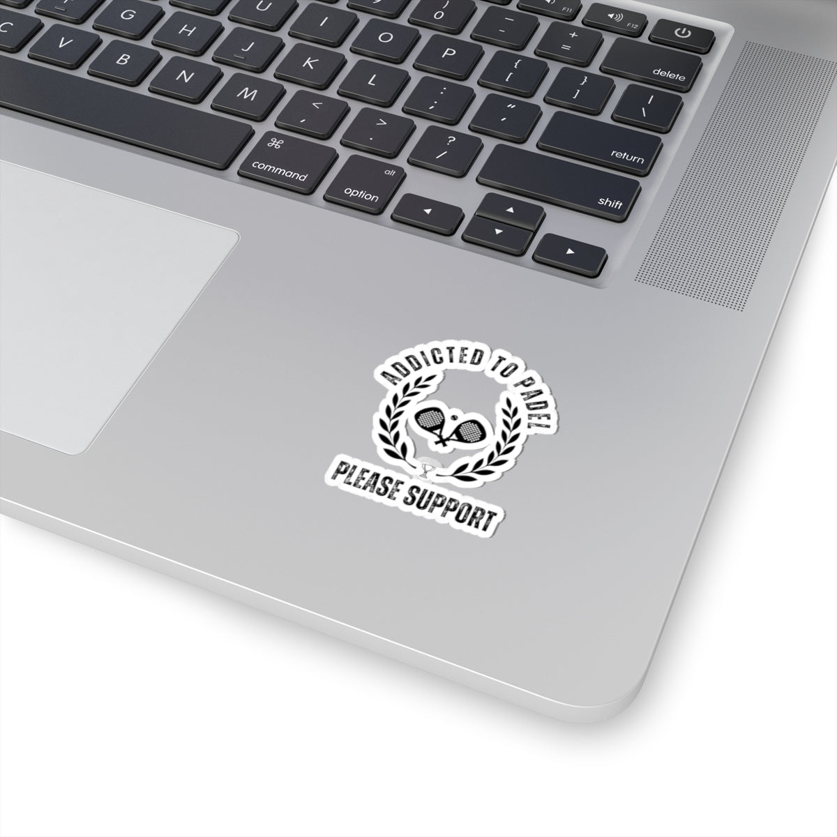 Laptop with a sticker on the palm rest area