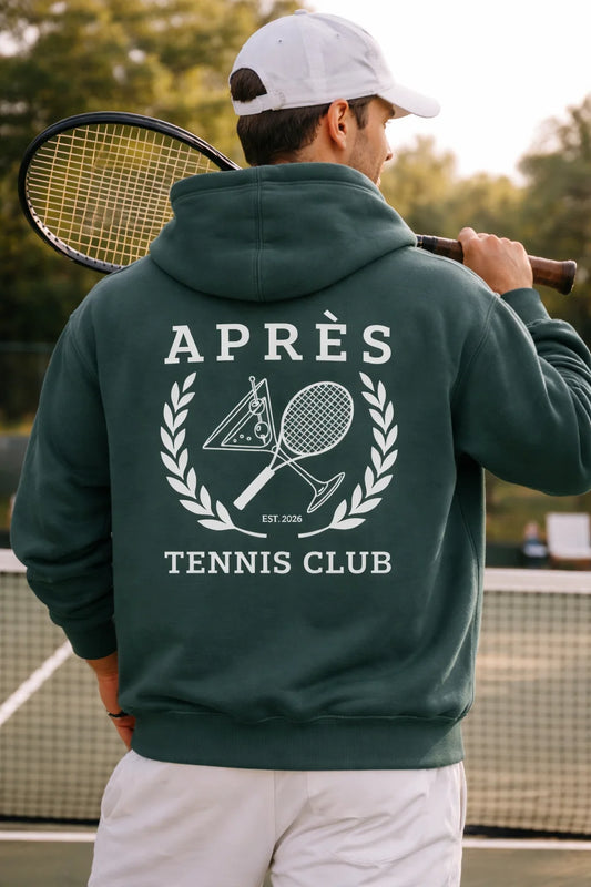 Tennis Club Hoodie Person wearing a green hoodie with 'Après Tennis Club' text and logo on a tennis court.