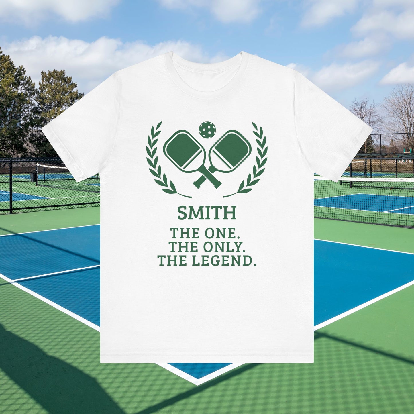 Funny pickleball shirt A white short-sleeve t-shirt with a green tennis-themed graphic and text reading 'SMITH THE ONE. THE ONLY.