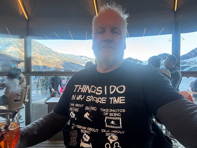 Laluedesign.com founder wearing the best-selling Ski T-shirt indoors in ski carousel