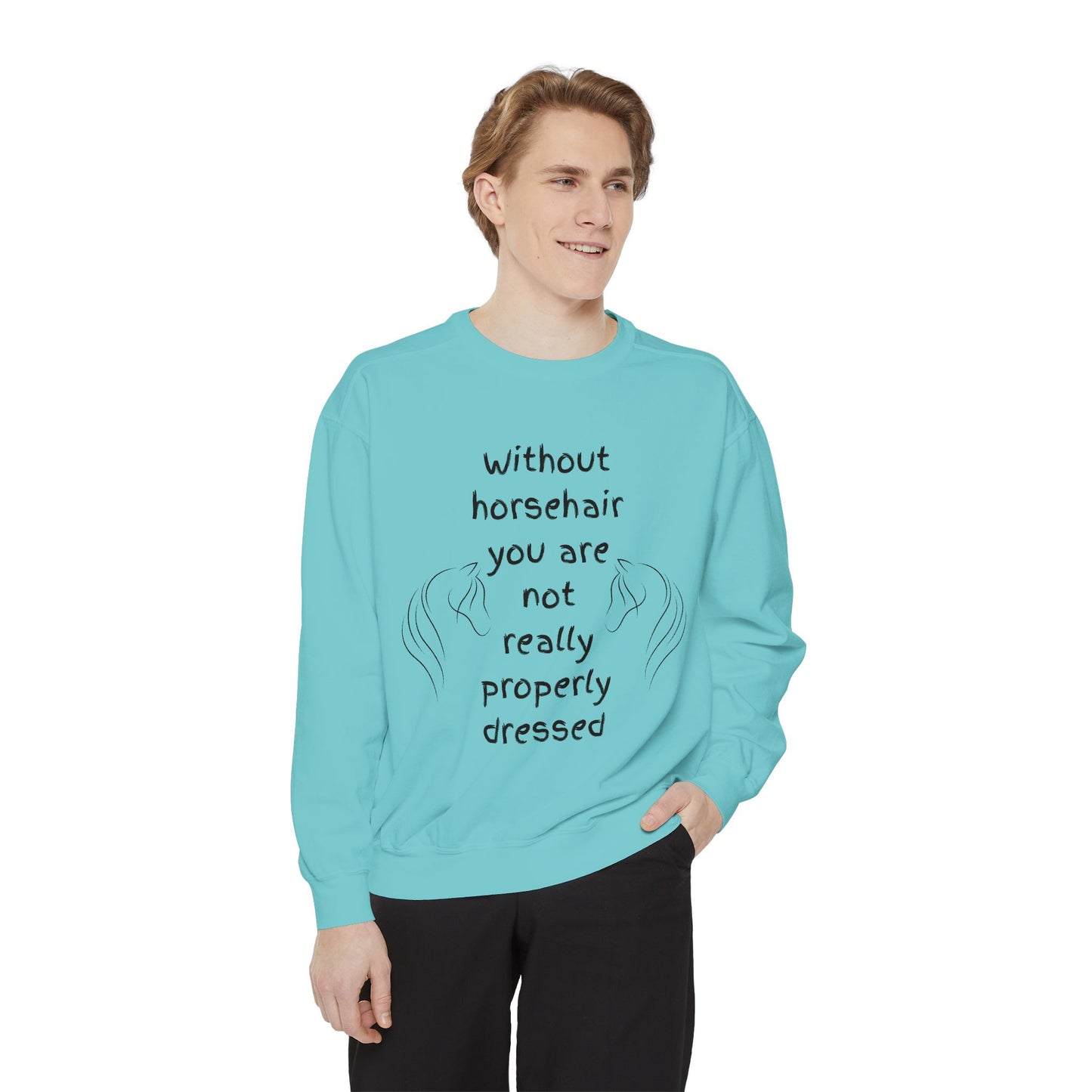 Person wearing a light blue sweatshirt with humorous text on a white background