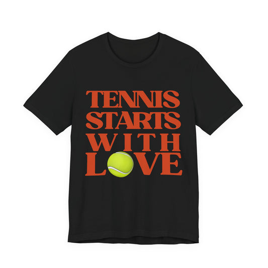 Black t-shirt with 'Tennis Starts With Love' text and tennis ball graphic on a white background
