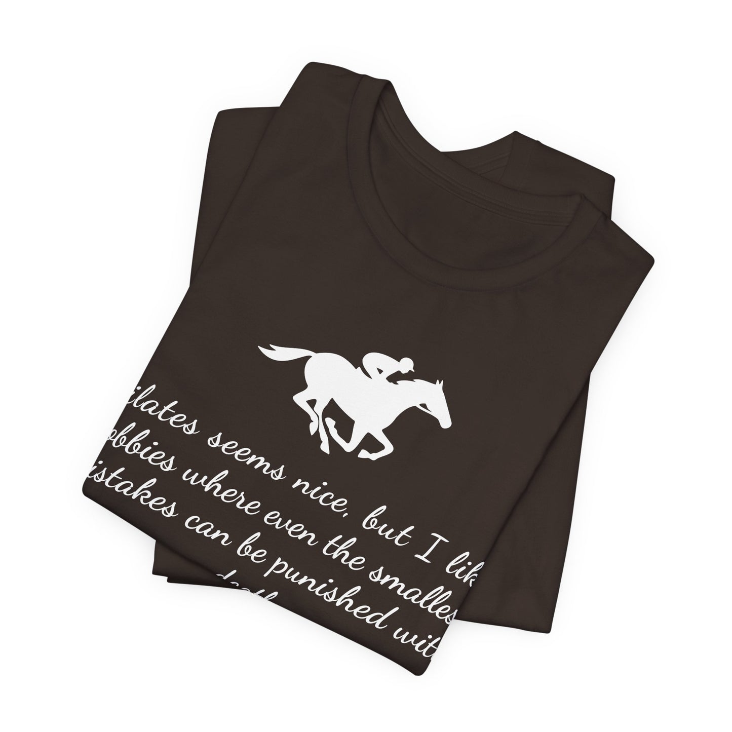Folded black t-shirt with white horse and text design on a white background