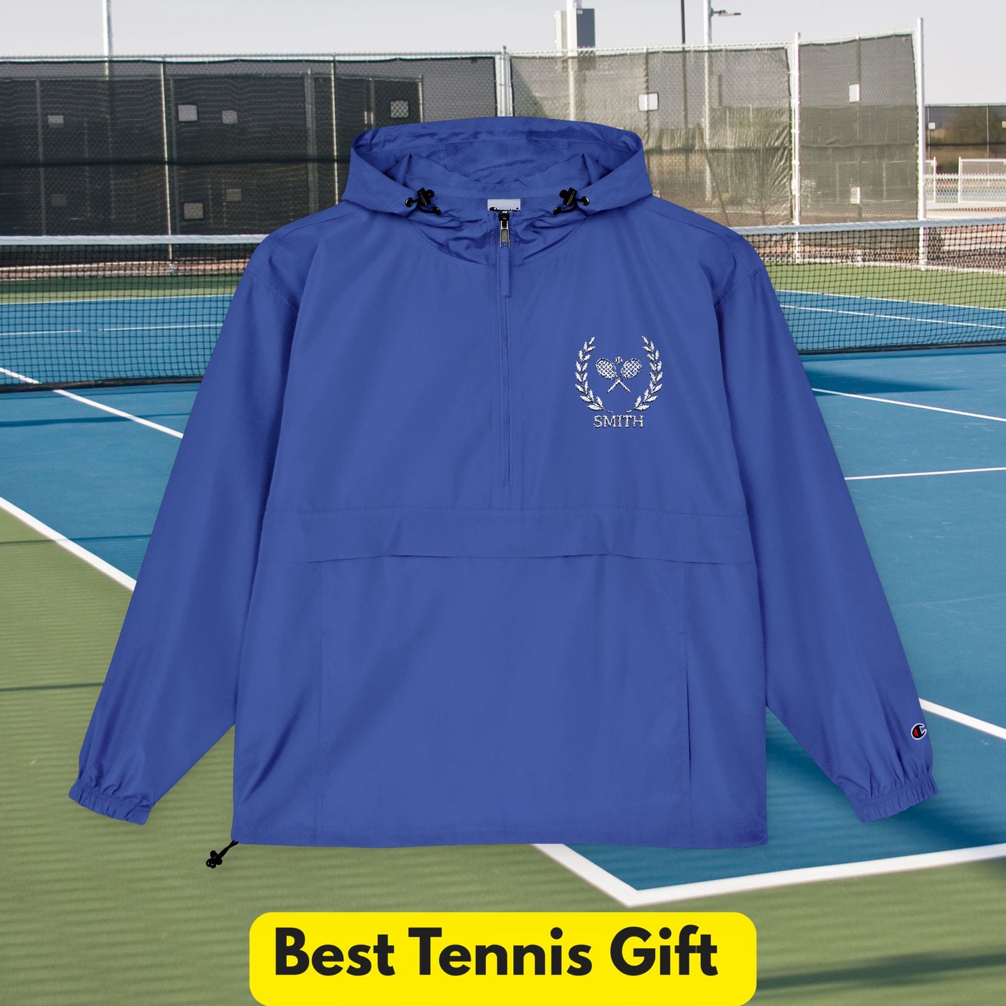 Tennis jacket Blue hooded jacket with a logo on a tennis court background, labeled 'Best Tennis Gift'.
