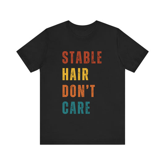 Black t-shirt with colorful text 'STABLE HAIR DON'T CARE' on a white background
