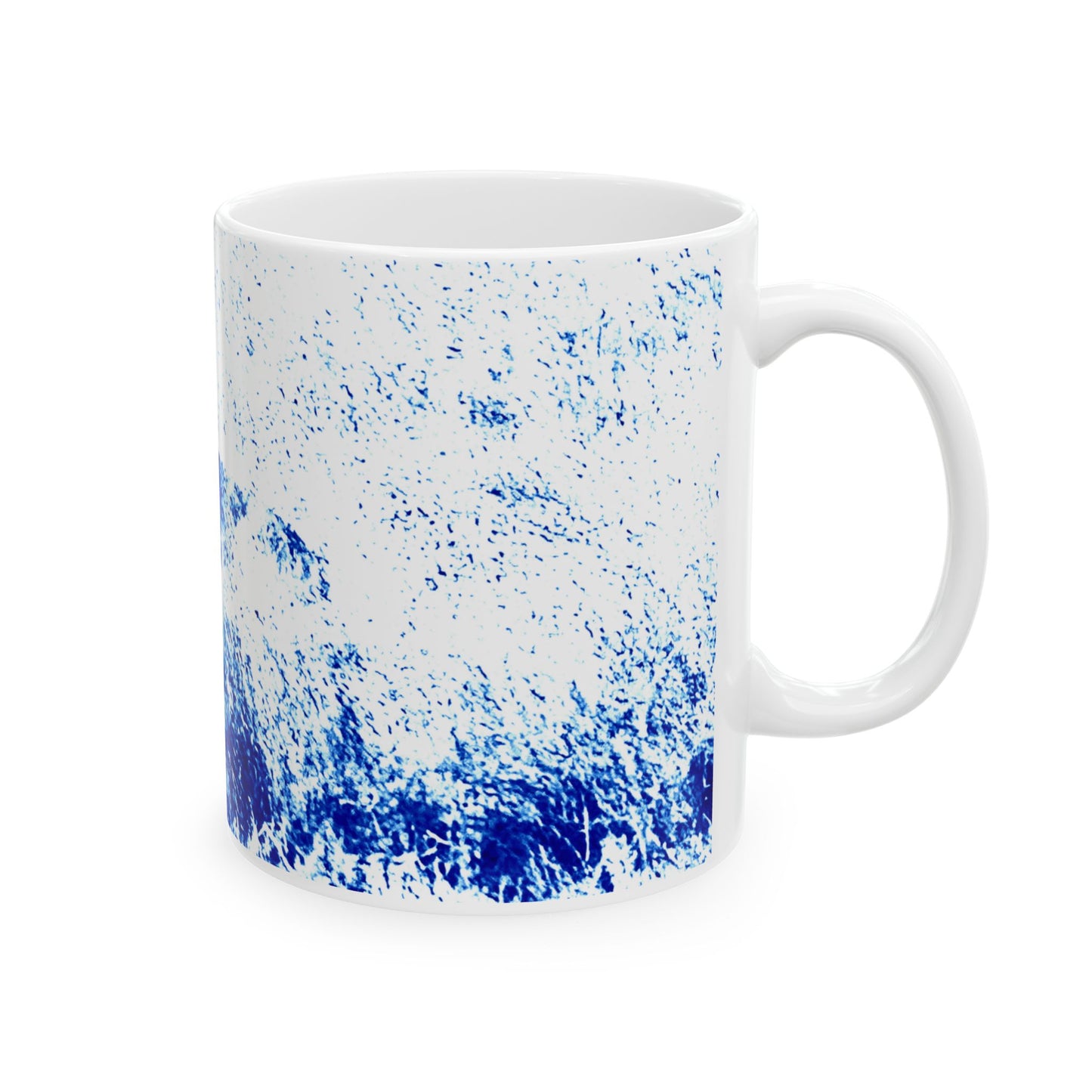 White mug with blue speckled pattern on a white background