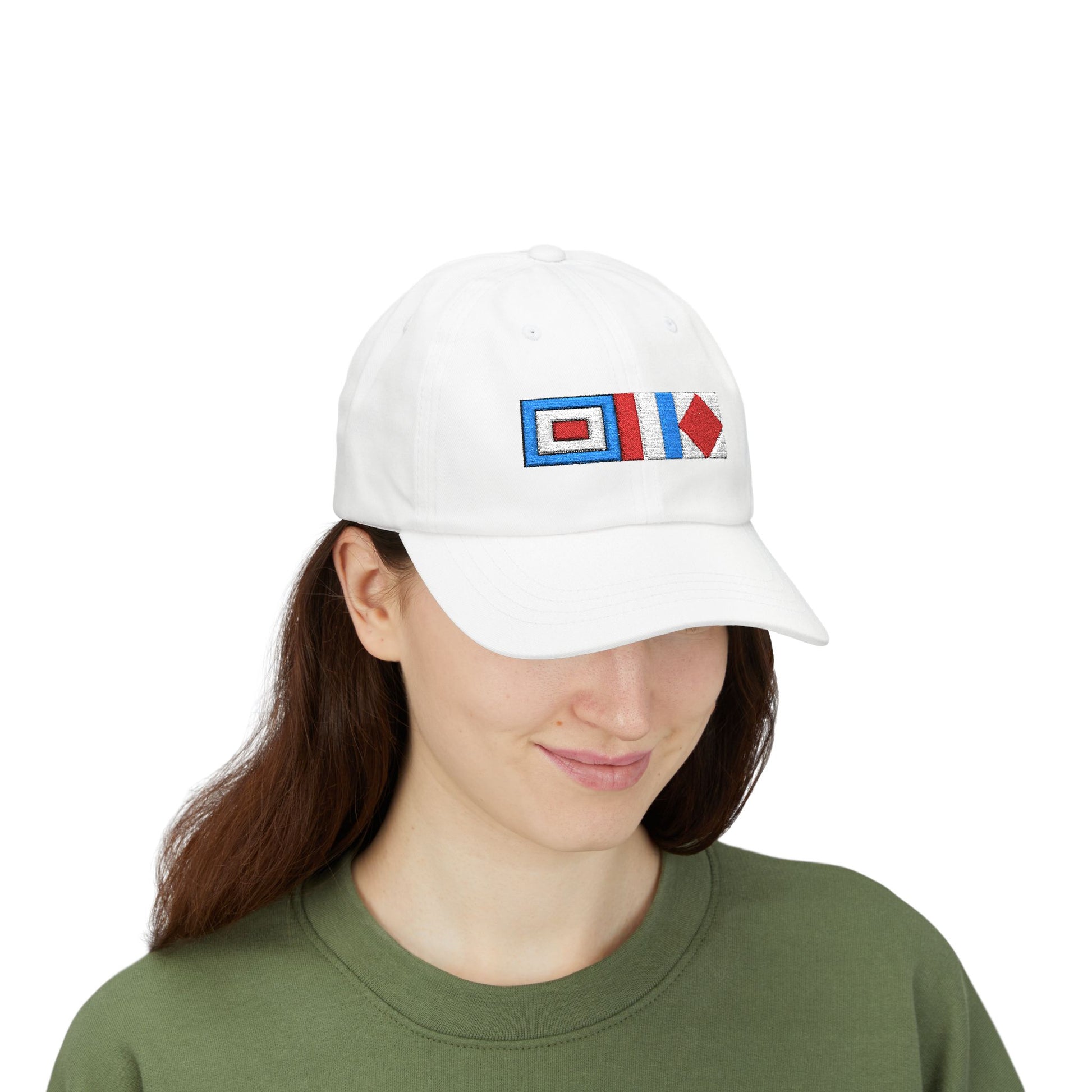Sailor Cap White cap with embroidered design worn by a person on a white background