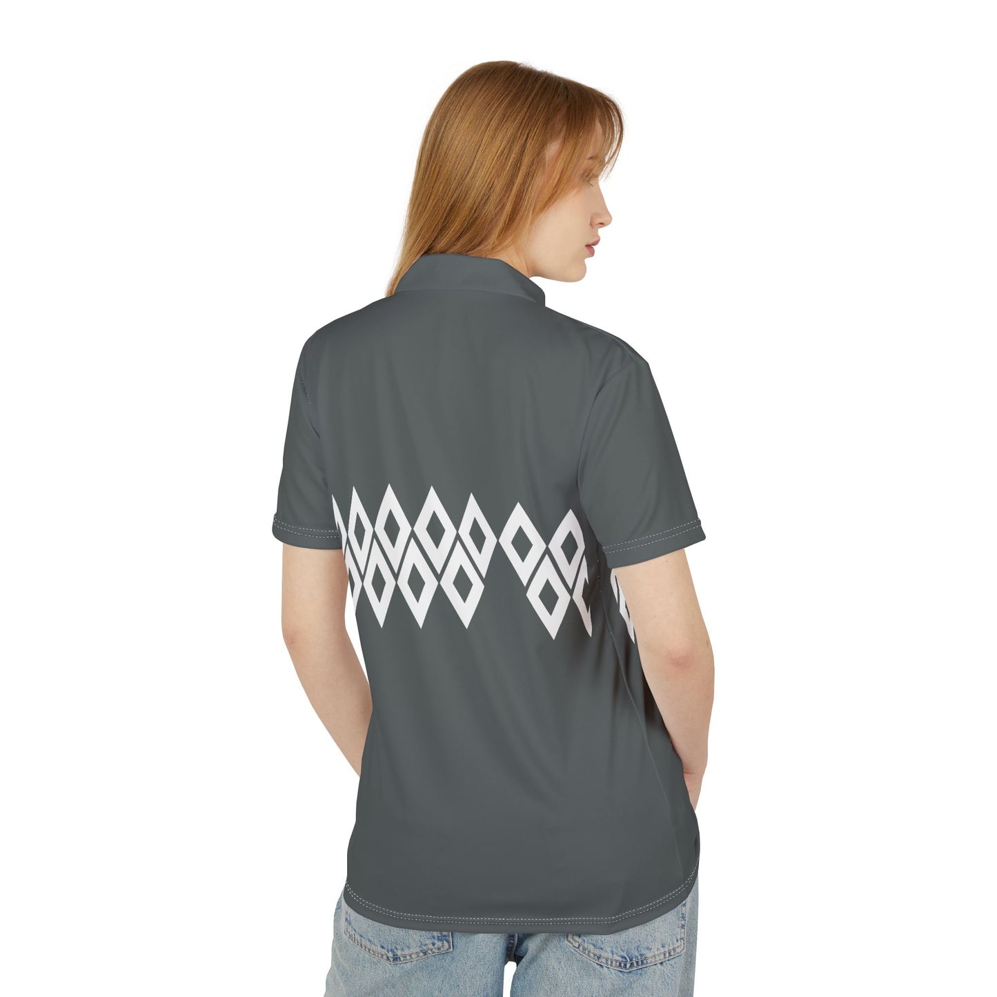 Person wearing a gray polo shirt with a white geometric pattern on the back, on a white background
