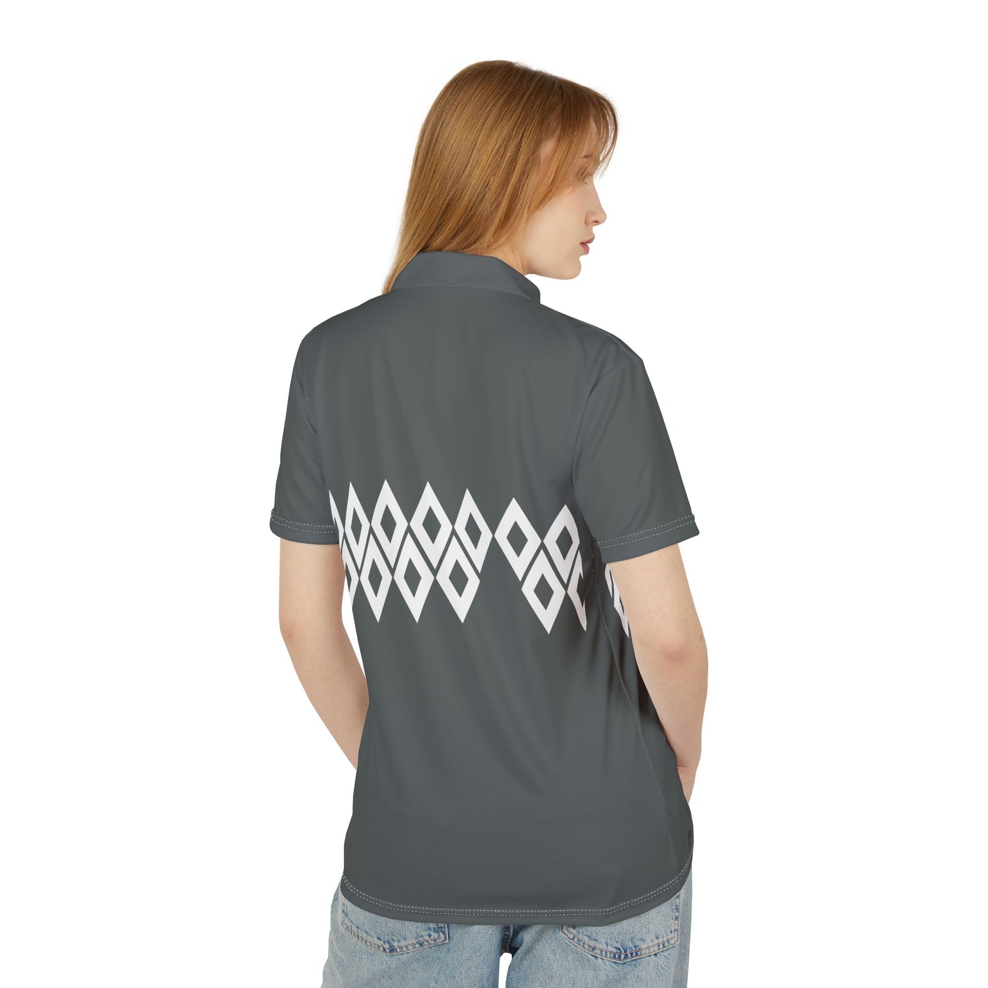 Person wearing a gray polo shirt with a white geometric pattern on the back, on a white background