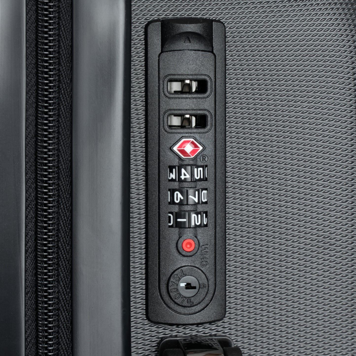 Close-up of a suitcase's combination lock mechanism.