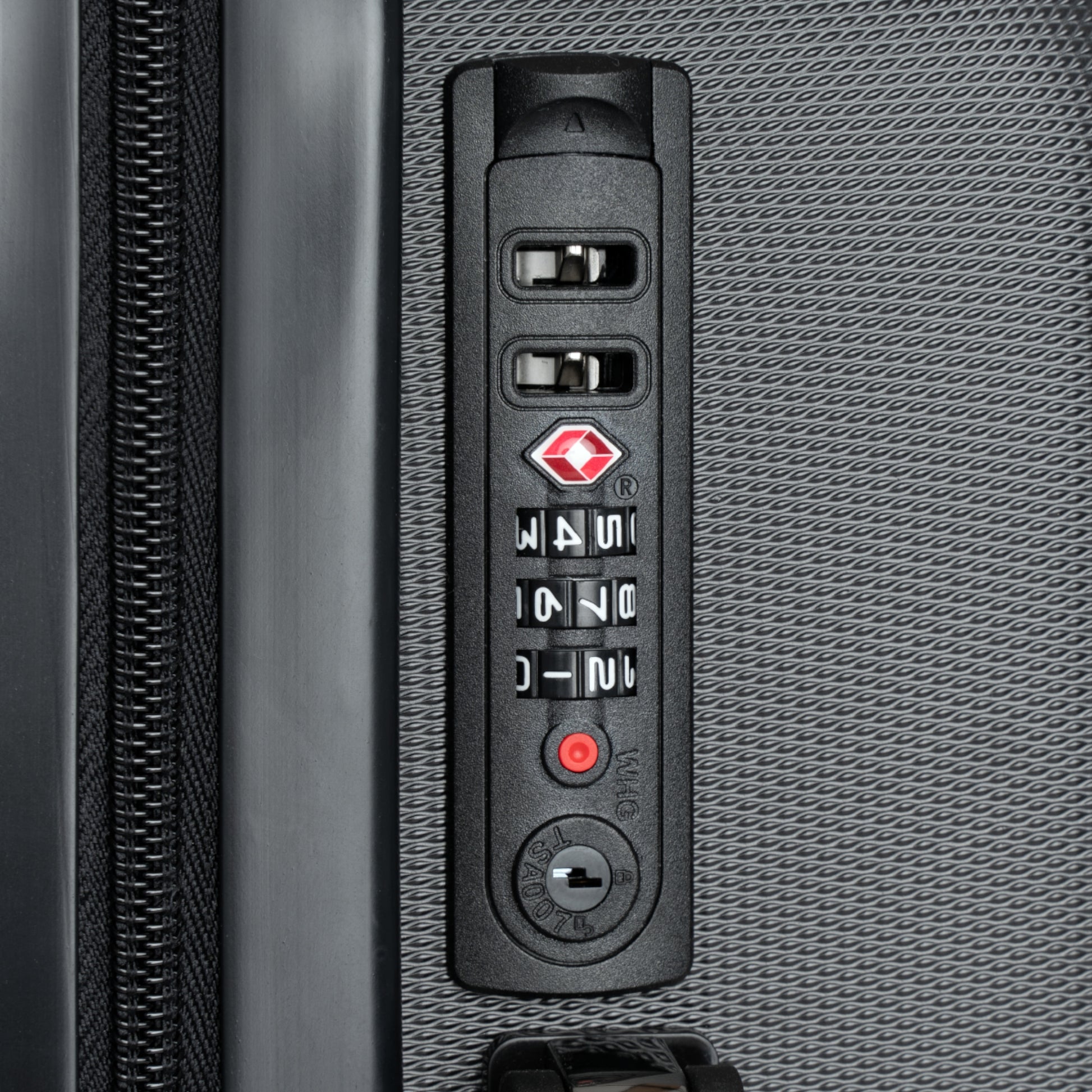 Close-up of a suitcase's combination lock mechanism.