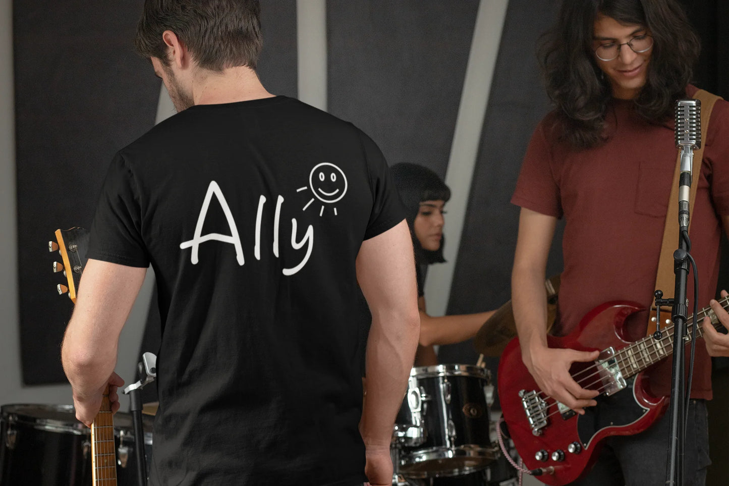 Ally music band Shirt Two musicians playing guitar with one wearing a black t-shirt with 'Ally' on the back.