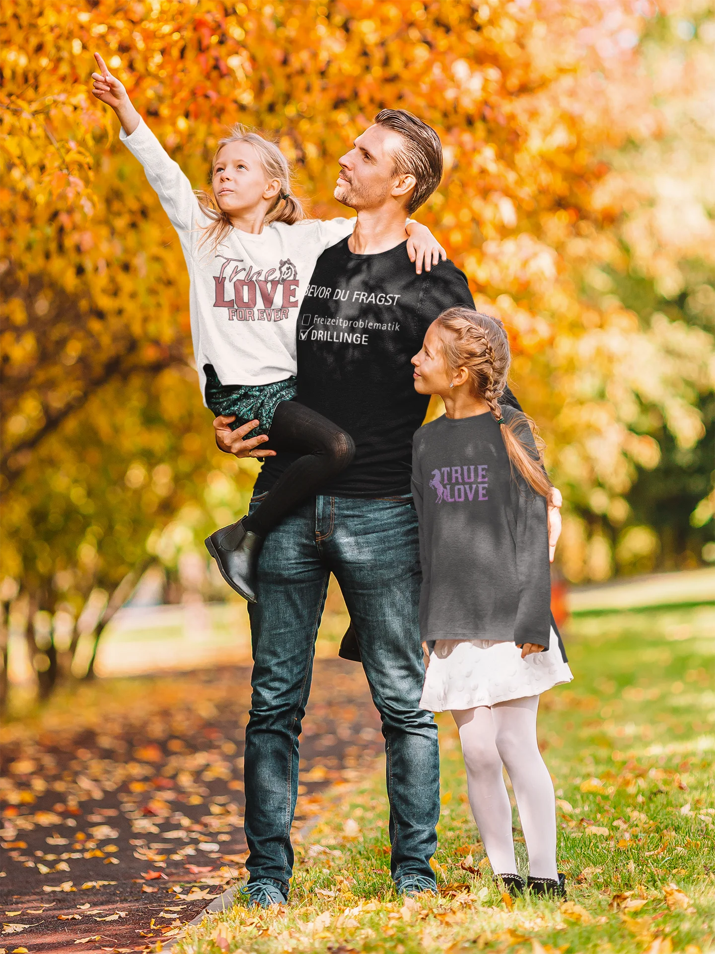 Gift for Triplets Man holding a child with two other children in an autumn setting