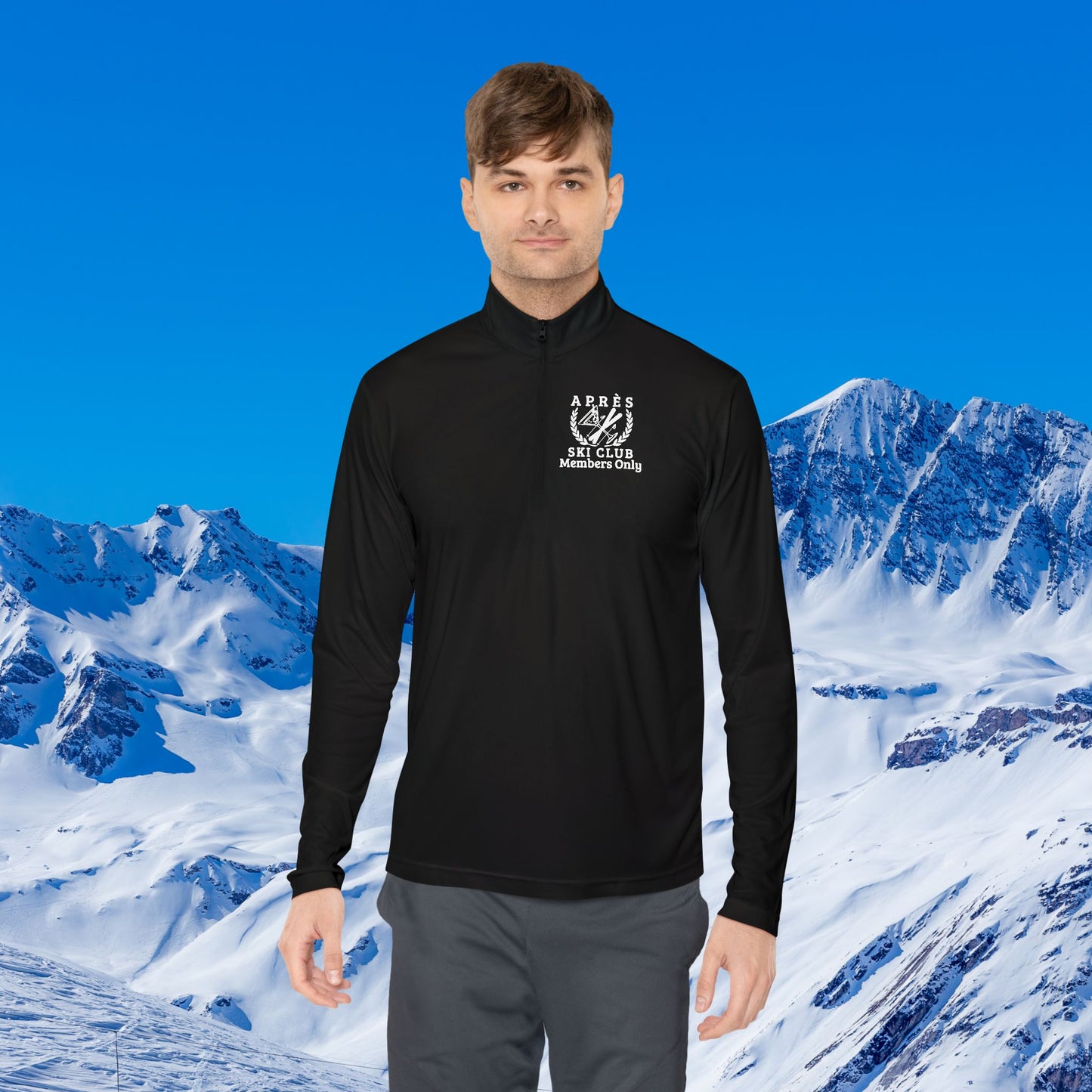 Ski Pullover A man wearing a black long-sleeve quarter-zip athletic shirt with a white 'Arves Ski Club Adventurers Club' logo on the left chest, set against a digital background of snowy mountains and a blue sky.